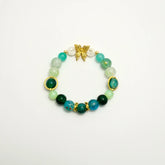 Green beaded bracelet with gold butterfly and TS initials, front view