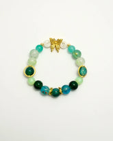 Green beaded bracelet with gold butterfly and TS initials, front view