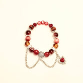 Red love-in- progress bracelet with heart charm and silver chain, main image