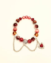Red love-in- progress bracelet with heart charm and silver chain, main image