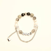 TTPD bracelet with letter beads and silver chain heart charm, front close-up