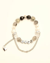 TTPD bracelet with letter beads and silver chain heart charm, front close-up