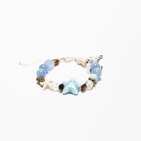 1989-inspired bracelet in blue tones with seagull charm and ocean-themed beads