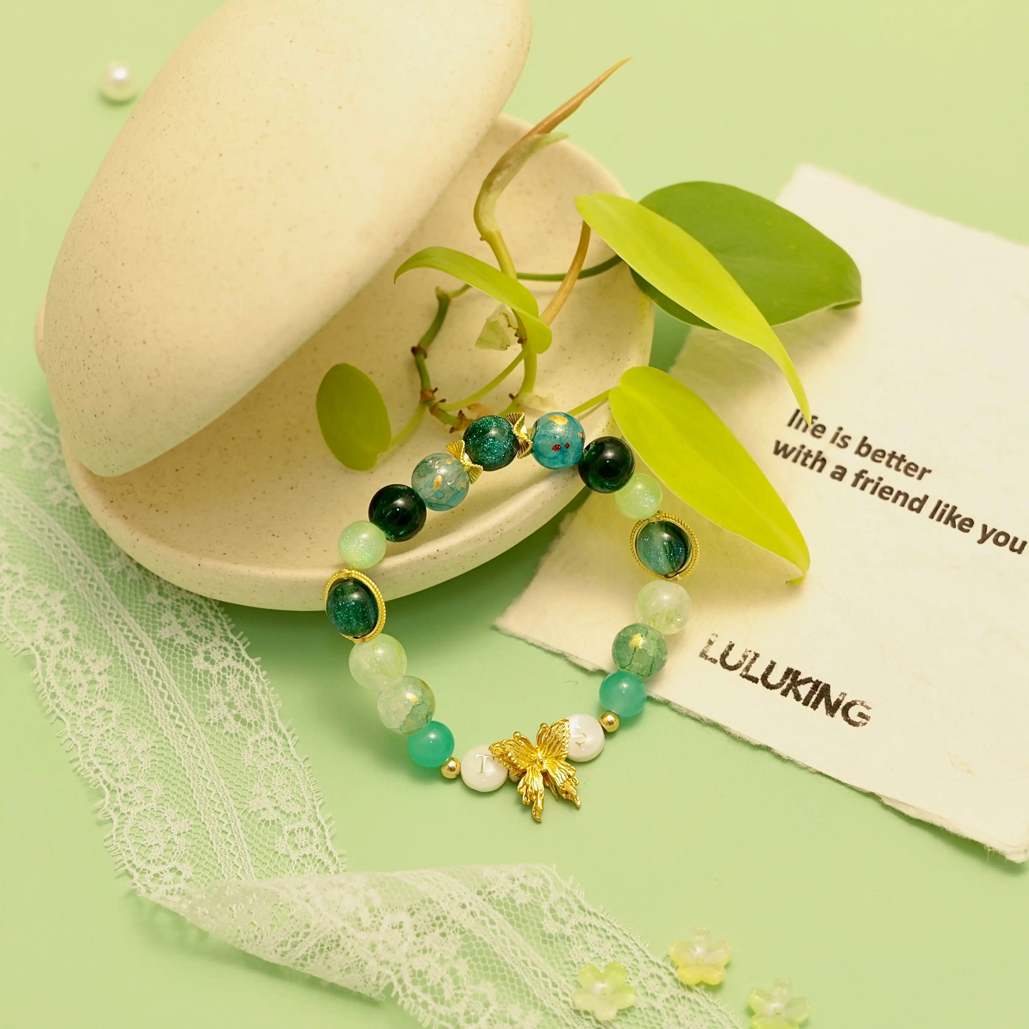 Nature-styled bracelet shot with leaf props and organic textures