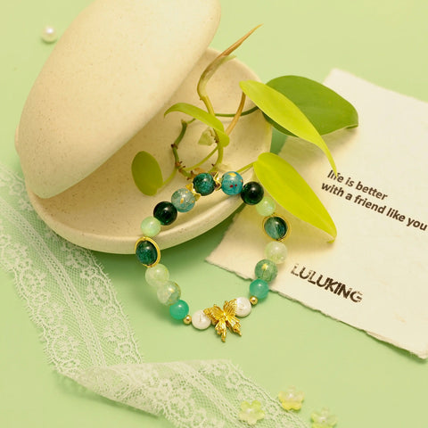Nature-styled bracelet shot with leaf props and organic textures