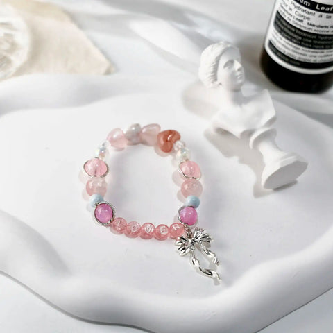 Styled image of the Lover bracelet with feminine props and romantic lighting