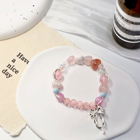 Complete view of the Lover bracelet showing full beaded circle with silver charm detail