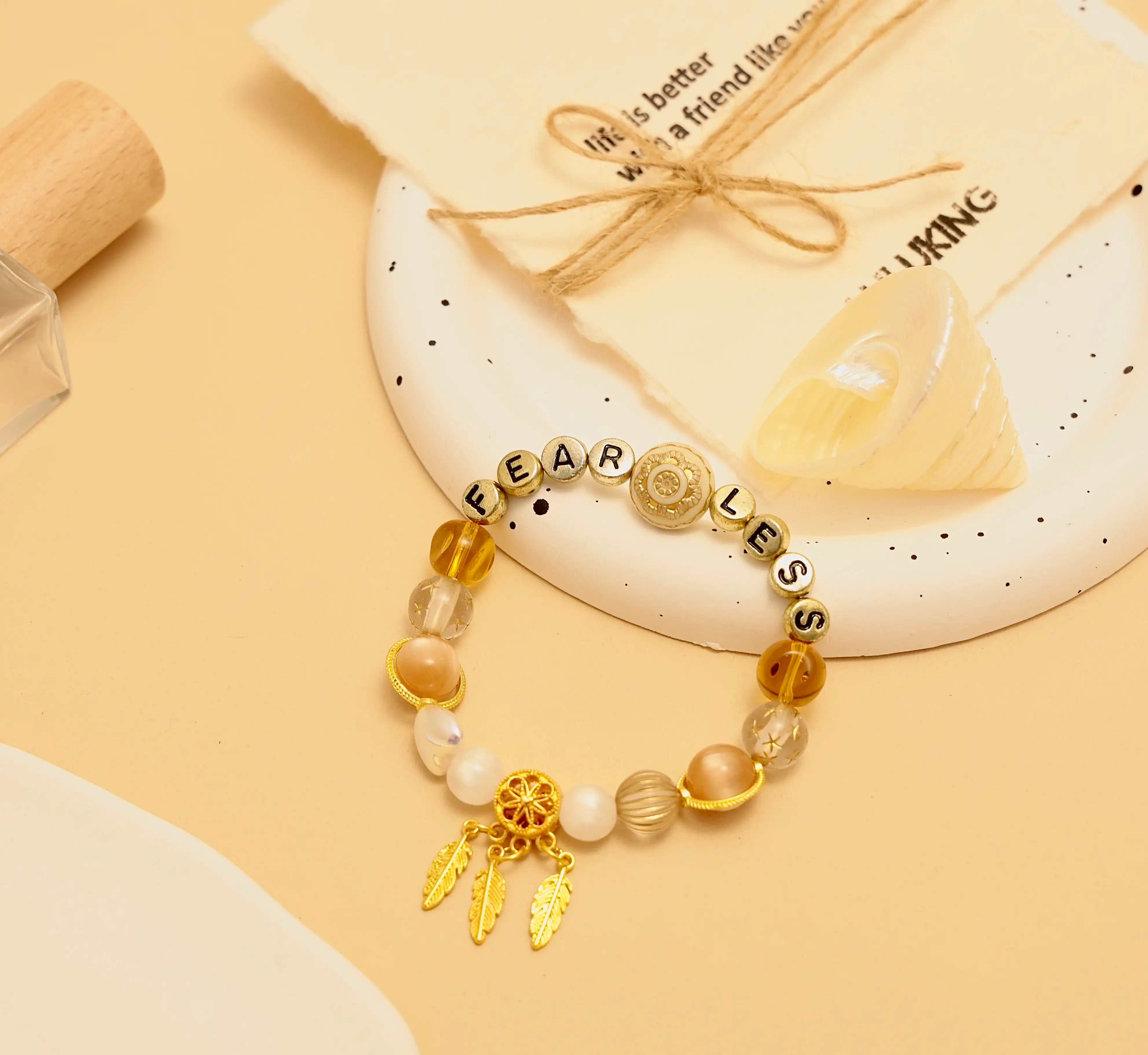 Flatlay of Starlit Steps bracelet on a styled beige tray with natural accents