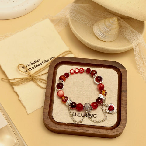 Bracelet in jewelry box with message card, styled scene