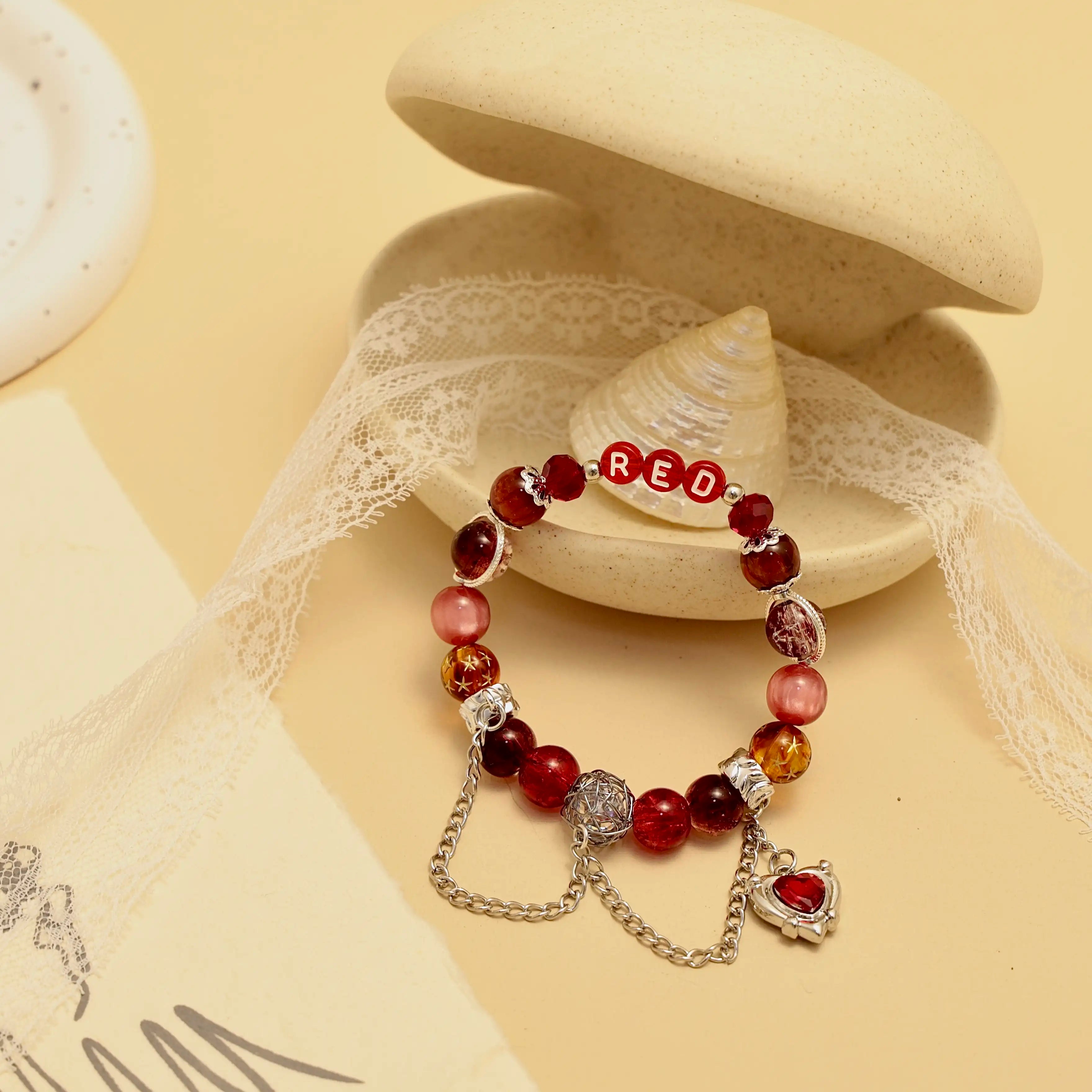 Styled bracelet with lace and shell prop, romantic tones