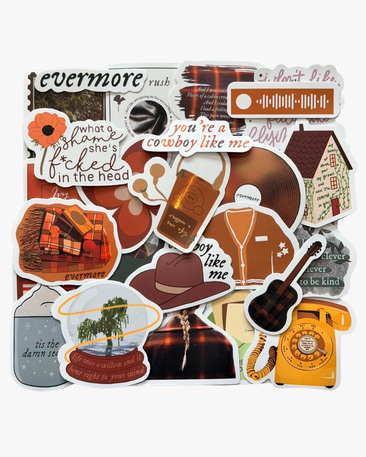 Warm brown plaid stickers inspired by the evermore era, featuring willow tree, champagne, and ivy motifs.