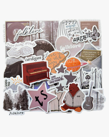 Cottagecore grey stickers inspired by the folklore era, with cardigan, pine trees, and mirrorball designs.