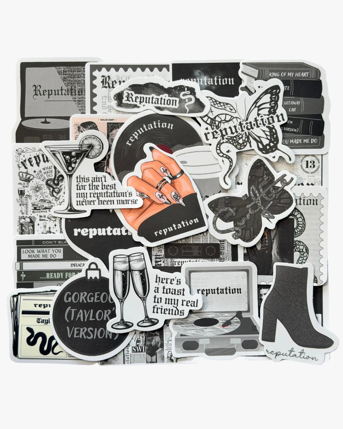 Edgy black and white stickers inspired by the Reputation era, with snake, newspaper, and gothic font details.