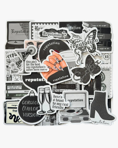 Edgy black and white stickers inspired by the Reputation era, with snake, newspaper, and gothic font details.