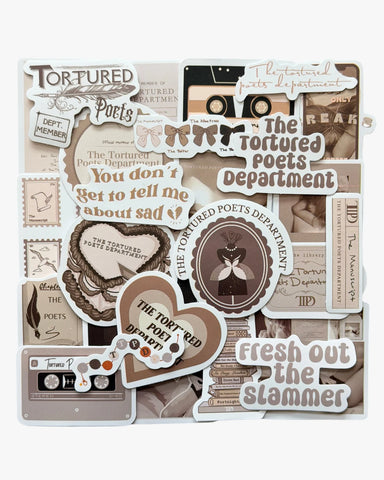 Sepia-toned stickers inspired by The Tortured Poets Department era, featuring typewriter, quill, and lyrics designs