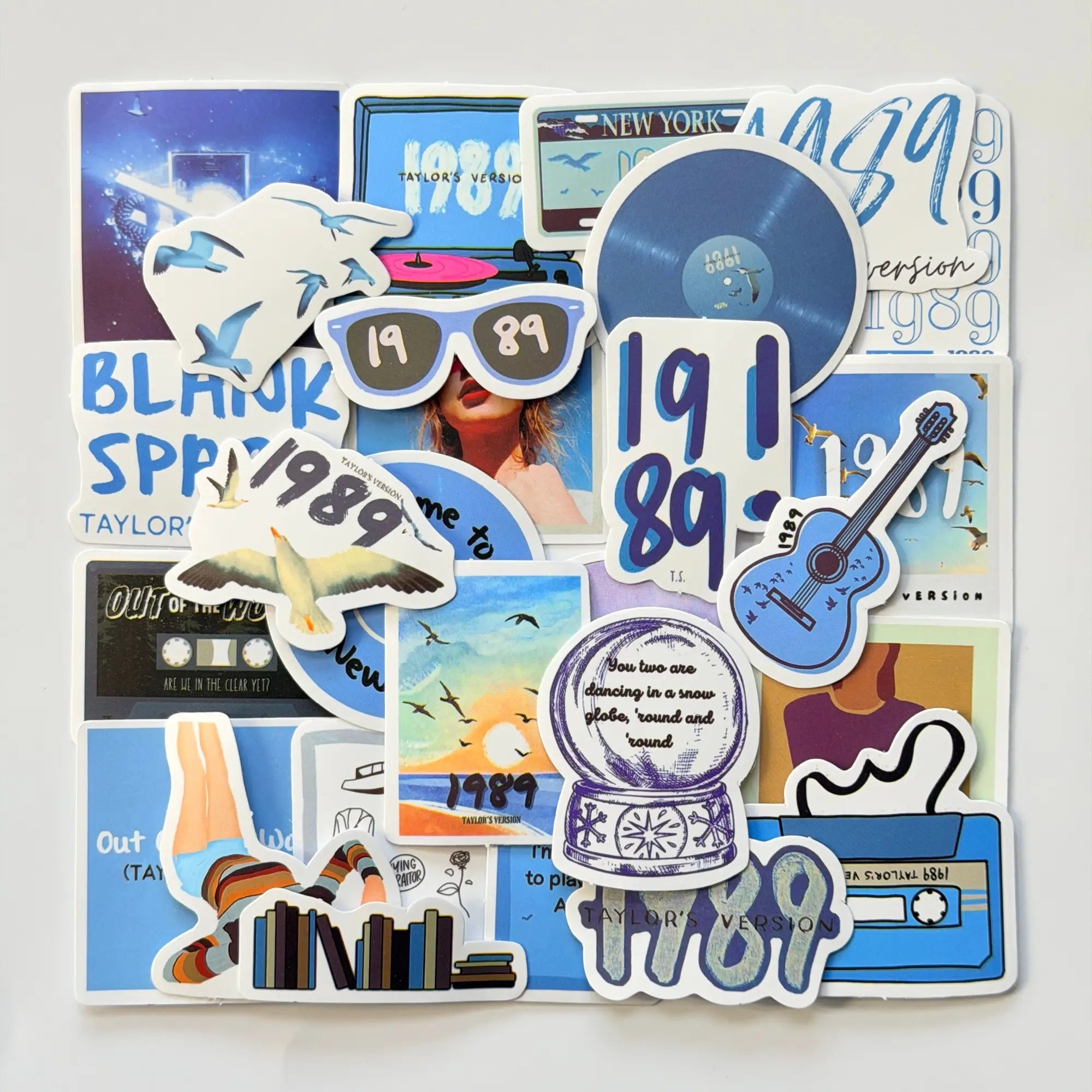 Taylor Swift inspired 1989 Taylor’s Version Swiftie stickers set with 50 different fan-made designs, blue pastel colors, city vibes and pop era visuals
