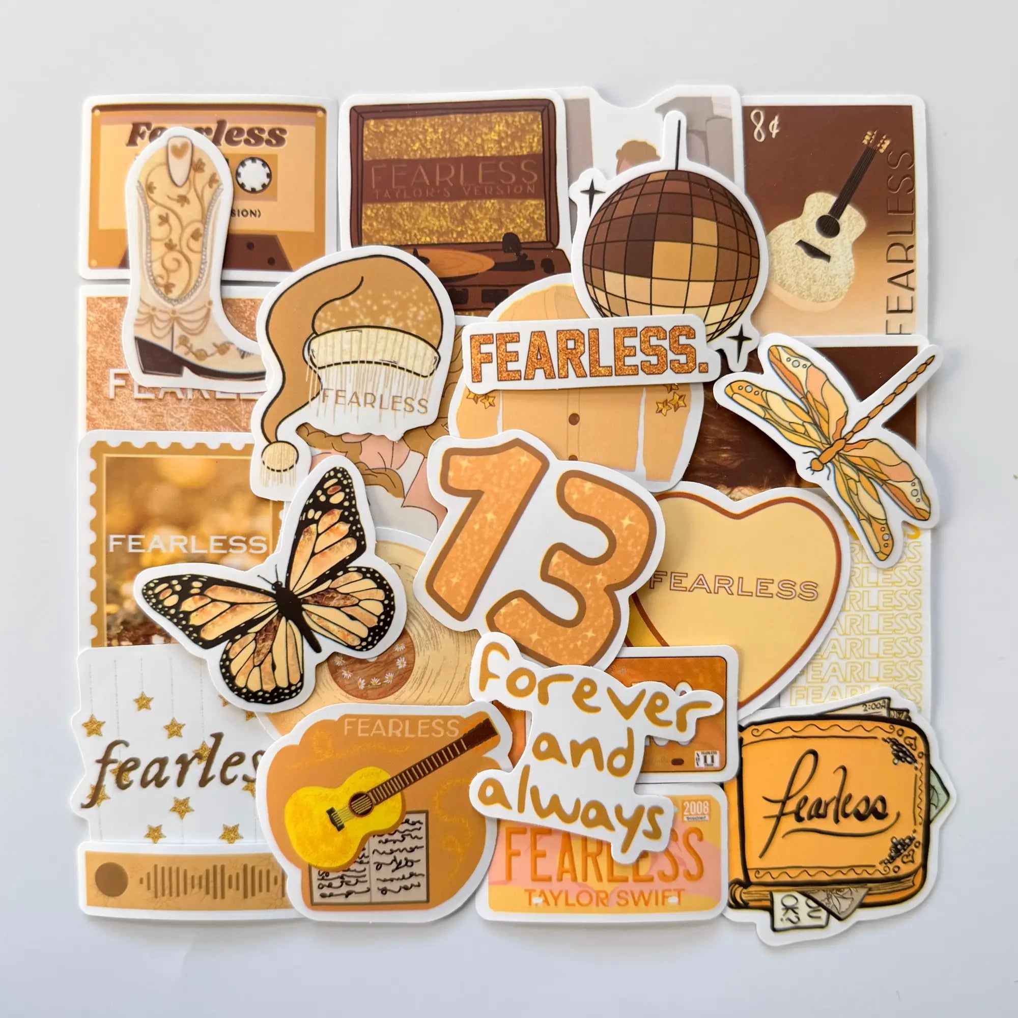 Taylor Swift inspired Fearless Taylor’s Version Swiftie stickers set with 50 unique fan-made designs, golden tones, butterflies and iconic Fearless era elements